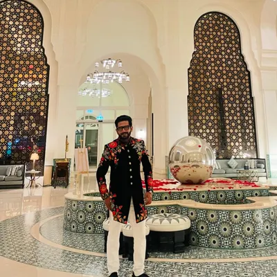 For a 'Shaam-E-Sufiyana' in Qatar, this black floral sherwani set the perfect tone of elegance and artistry. The intricate embroidery reflects the soulful vibe of the evening.