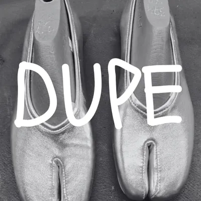 The first draft of something disruptive. This is a look at the silver leather 'DUPE' Tabi flat on its shoe last, a key part of the development process. The wait is almost over.