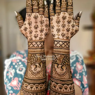 A beautiful example of full-coverage Indian bridal mehendi. This design features elegant peacocks on the wrists and a delicate floral pattern extending to the fingertips.