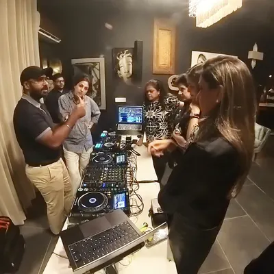 Explaining the functions of a Pioneer DJ controller to members of EO New Delhi. I make sure everyone in the group understands the 'why' behind every button and knob.