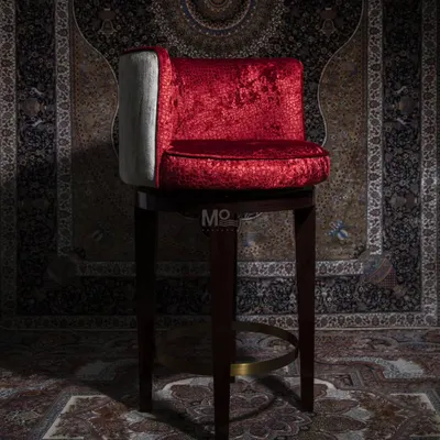 Inspired by classic royal aesthetics, the Old Fashioned Bar Chair is a bold statement piece. The vibrant red velvet upholstery exudes opulence, while the polished brass footrest adds a golden touch of luxury.