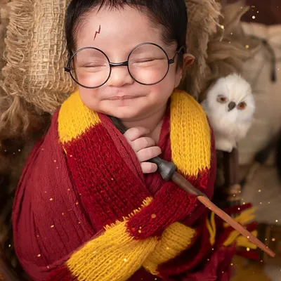 The boy who smiled. This little wizard's magical grin is the best special effect we could ask for in our Harry Potter-themed newborn setup.