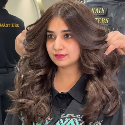 A beautiful mocha brown, achieved with zero bleach. Notice the volume, shine, and healthy texture of the hair after our coloring service.