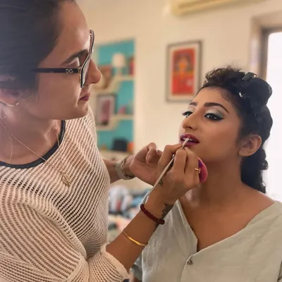 Creating a beautiful look for this client's engagement party. Here, I am applying the final touches to her lip color, completing a glamorous yet elegant makeup style perfect for celebrating a special milestone.