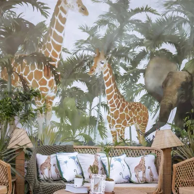 For Neomi and Rakshit's safari-themed sundowner, we created this immersive photo booth with a custom-printed jungle wallpaper. The rattan furniture and live plants made guests feel like they were in a luxe safari lodge.
