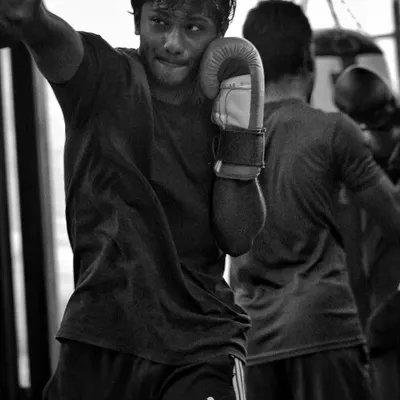 Working the heavy bag is about more than just power. It's about rhythm, footwork, and endurance. Every punch is a story of sweat and grit.