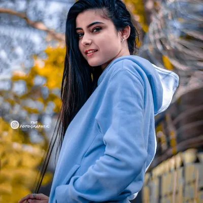 A bright, youthful portrait taken outdoors. The vibrant colors and happy expression make this a perfect example of a lifestyle shoot.
