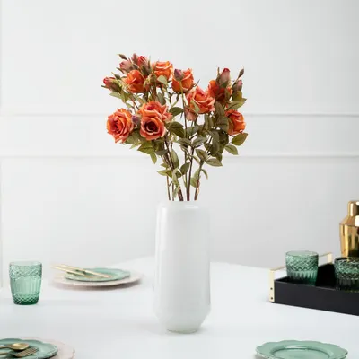 An elegant tablescape styled for a home decor brand. I used a clean, bright setting with green and gold accents to create a fresh and modern dining look, centered around the floral arrangement.