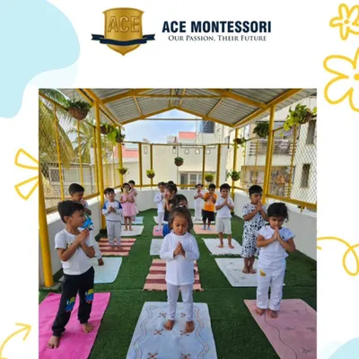 A group of children stand in a prayer pose during our yoga session. We teach them simple poses and breathing exercises to promote calmness and body awareness.