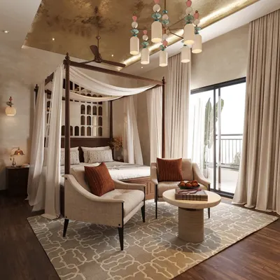 This bedroom is where earthy minimalism meets understated opulence. A four-poster bed is draped in soft, airy fabric, set against a backdrop of warm neutral textures. The delicate gold leaf design on the ceiling glows softly, adding a touch of richness without overpowering the serenity.