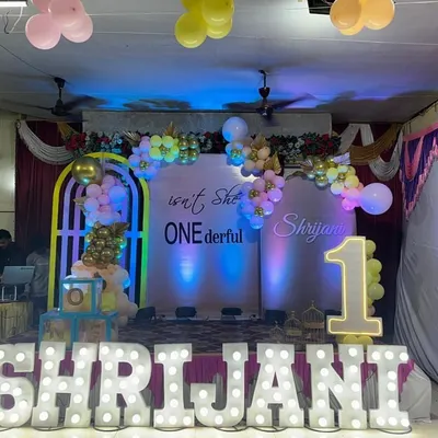 A full view of the "ONEderful" first birthday party stage we set up in Matunga. The large marquee letters, custom backdrop, and balloon decorations create a grand and festive look.