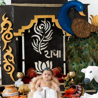 My custom-built Janmashtami set is ready for your little Krishna. The details, from the peacock to the 'Radha' inscription, make these photos truly special.
