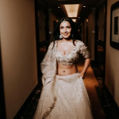 Shubhangi looking absolutely radiant and happy for her engagement. We went for a soft glam look with open hair to complement her stunning white Dolly J Studio lehenga.