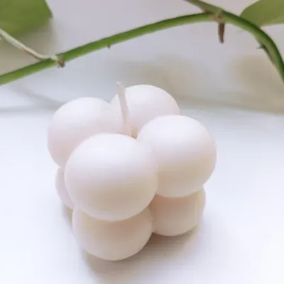 A close-up of my handcrafted soy wax bubble candle. Its unique, mesmerizing design makes it a stunning decor piece that creates a soothing ambiance in any room.