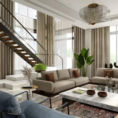 The family lounge in 'The Garden House' is flooded with natural light from double-height windows. The open-riser staircase maintains an unobstructed view and enhances the sense of spaciousness.
