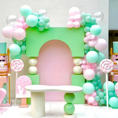 This pastel-colored setup features our sphere box arch backdrop and a matching sphere base table. Paired with nutcracker props and candy decorations, it shows how our modern backdrops can be styled for a whimsical theme.