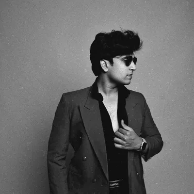 A black and white shot with a strong, classic feel. This demonstrates my ability to pull off a more intense, high-fashion look with a retro hairstyle and sunglasses.