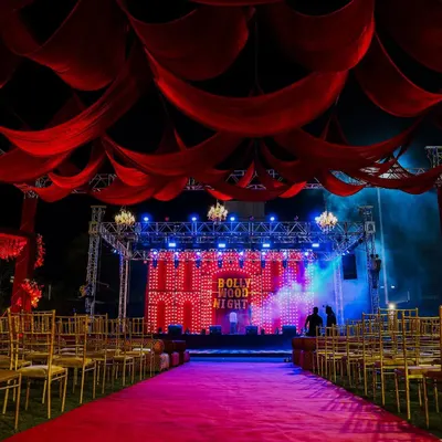 For a full-on filmy Sangeet, we created this Bollywood Night theme. The red carpet entrance, dramatic drapes, and retro bulb-lit stage made everyone feel like a superstar.