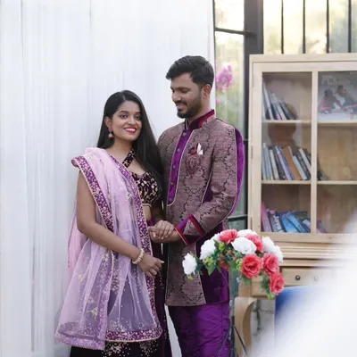 This is one of my coordinated ethnic wear sets, featuring a deep purple velvet lehenga with gold embroidery and a matching patterned sherwani. It's a perfect rental option for an elegant pre-wedding shoot.