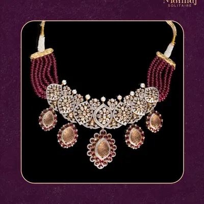 This chunky Polki necklace is a perfect balance of boldness and elegance. The design features uncut diamonds and ruby-colored beads, creating a statement piece that defines confident, royal style.