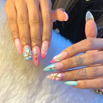 This set is all about playful dimension and color. We combined pastel pink and blue tones with sharp French tips and intricate 3D butterfly and flower charms for a look that's pure fantasy.