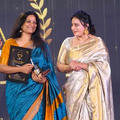 A candid moment on stage after receiving the Karnataka Women Achievers' Award for Excellence in Music. I am filled with gratitude for this recognition.