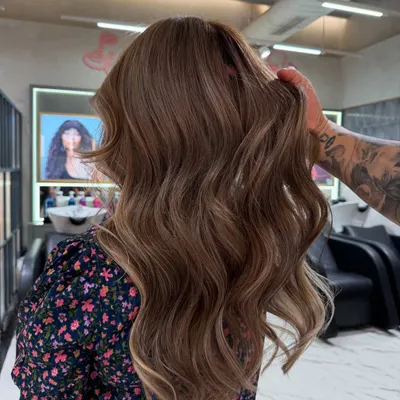 A perfect example of a soft, natural balayage. The hand-painted highlights are blended seamlessly into the hair, creating gentle waves of color and beautiful dimension when styled.