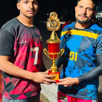 Our players holding the winner's trophy after securing the first position in a tournament in Meerut.