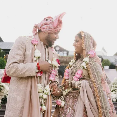 These aren't just pictures; they are moments that prove such love still exists. This couple's coordinated pastel outfits from Marwar Couture and Anita Dongre create a look of soft, romantic elegance.