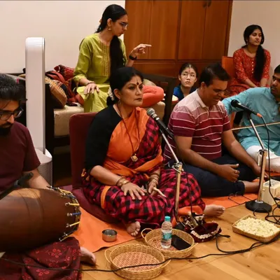 As a guru, I am deeply involved in every aspect of the arangetram, including conducting the nattuvangam during rehearsals. This is a candid moment from the music session for Anvita Jain's performance.