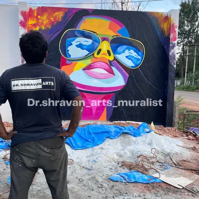 This vibrant, colorful graffiti portrait on an exterior wall is designed to grab attention and bring flavor to a restaurant's dining experience. Come for the art, stay for the food!