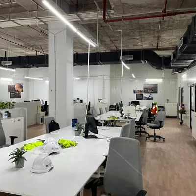 A view of the main open-plan workspace from our completed IKEA project. This photo shows the final installed workstations, collaborative tables, and integrated storage solutions, all part of our comprehensive interior execution.