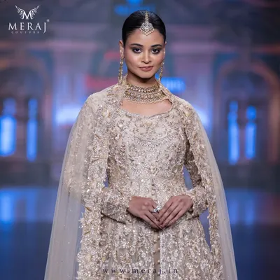A vision in gold, a statement in style. This Gold Tail Peplum Indo-Western is an exquisite blend of tradition and modernity, perfect for the grandest wedding receptions.