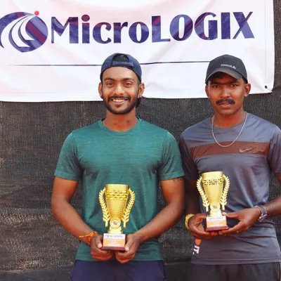 The champion and finalist from the MicroLogix Men's 50k tournament, holding their well-earned trophies. A great end to a competitive event hosted on our clay courts.
