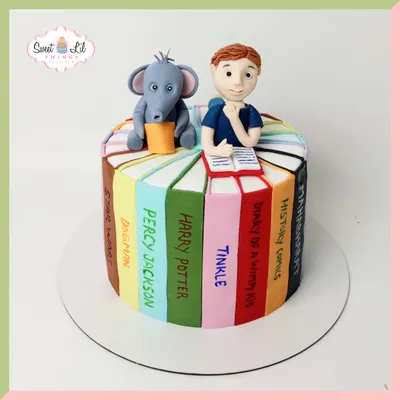 For the love of stories! This book lover's cake is designed to look like a stack of favorite books, including Harry Potter, Percy Jackson, and Diary of a Wimpy Kid, complete with a reading figurine.