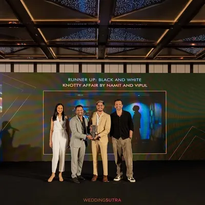It's always an honor to be recognized for the work I am so passionate about. Here we are on stage accepting the runner-up award for Black and White photography at the WeddingSutra Photography Awards 2024.