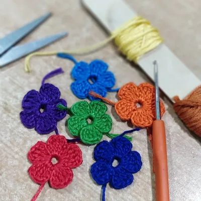 New projects often start with small, colourful components like these crochet flowers. I love experimenting with different shades to see how they will come together in a final piece.