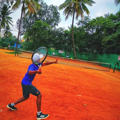 We start them young. Here’s one of our junior players executing a powerful forehand during a lesson, showing great form and focus. Our junior tennis program is designed to build a solid foundation from the very beginning.