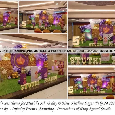 A royal princess theme for Stuthi's 5th birthday, featuring a stunning gold sequin backdrop and a purple and gold balloon garland. The setup includes a light-up number '5' and themed cylinder tables, creating a majestic party atmosphere.
