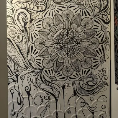 Here is the complete view of a mandala mural I created, combining a textured white base with intricate black doodle work. This piece was designed to transform a simple wall into a focal point of calm and detailed beauty, with every line and pattern painted by hand.