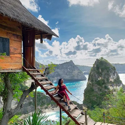 Making you the star of your Bali adventure at the Nusa Penida viewpoint. This shot is all about capturing the scale of the landscape and the feeling of being on top of the world.