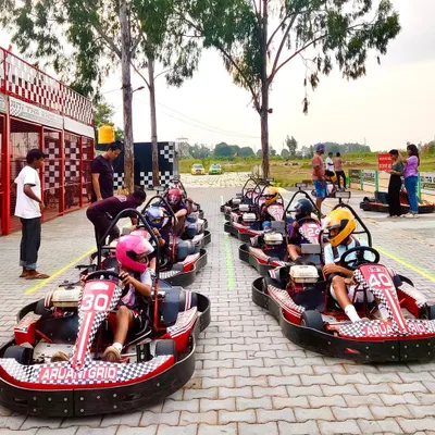 A full grid of our go-karts lined up and ready for action in the pit lane. This is the perfect activity for groups, friends, and families looking for some friendly competition.