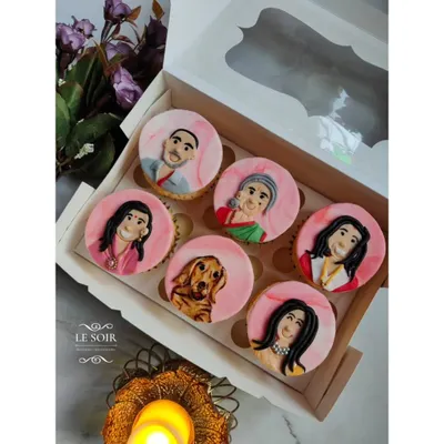 These custom cupcakes were so special to make. I hand-painted fondant portraits of an entire family, including their adorable golden retriever, to celebrate a special occasion. This is the kind of personal, edible art I love creating.