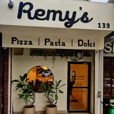 The storefront of Remy's, our Italian restaurant and cafe in Delhi. We designed it to be a warm and inviting space for everyone. We are open every day from 12 PM to 10 PM for dine-in and takeaway.