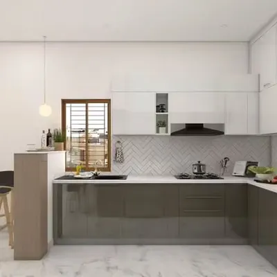 This bright and modern kitchen includes a neat breakfast bar for two. The two-tone cabinet design and herringbone backsplash create a stylish backdrop for this cozy and functional dining spot.