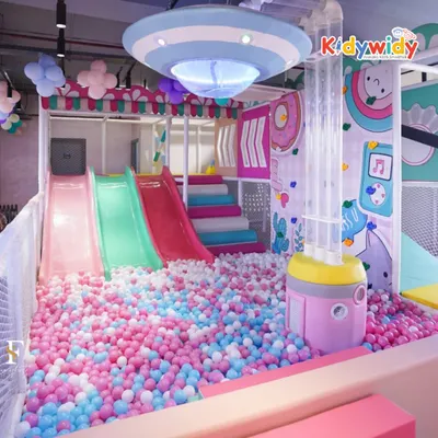 Welcome to The Fun Burrow! This magical playland features a huge ball pit with slides, offering endless fun for little ones in a pastel-themed, dreamy environment.