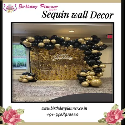 A classic and elegant birthday setup featuring a brilliant gold sequin wall. This backdrop is paired with a black and gold balloon garland and a neon "Happy Birthday" sign for a touch of modern glamour.