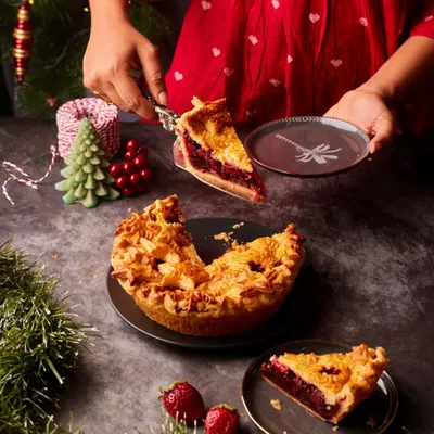 Slicing into our traditional Strawberry Balsamic Pie. We make this every year during the height of strawberry season, and it has become a beloved centerpiece for festive tables.