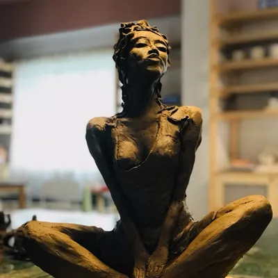 This stunning terracotta sculpture, "Naughty Girl," was brought to life by a student in our workshop. The piece is full of spirit and attitude, from the confident pose to the incredible detail in the hair and muscles.