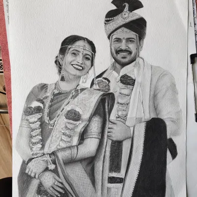 A completed graphite and charcoal wedding portrait on A3 paper. I worked to capture the elegance of the traditional Maharashtrian wedding attire and the happy expressions of the couple on their special day.